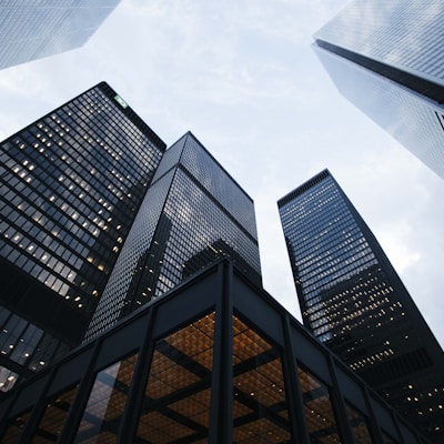 Modern towers representing long-horizon wealth growth